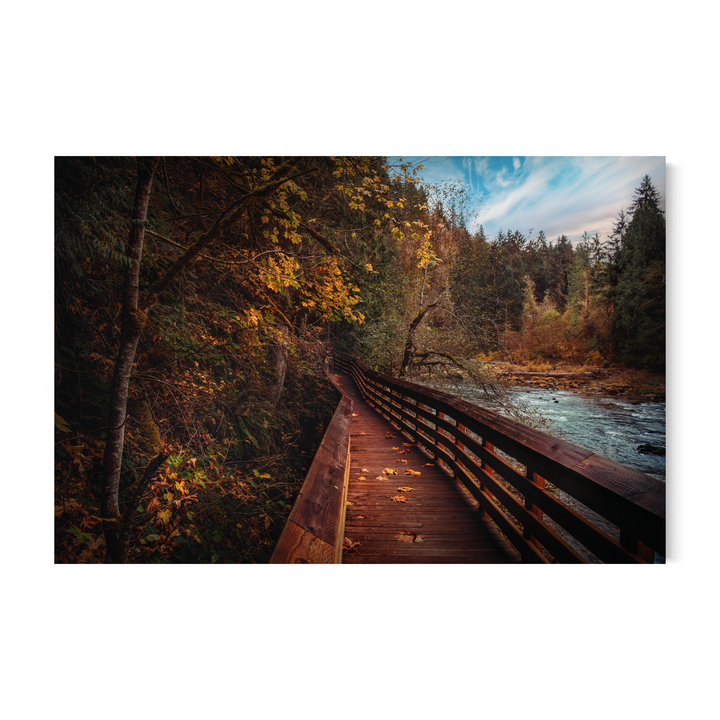 Autumn bridge print, PNW landscape photography, fall foliage artwork, nature wall decor, rustic cabin print, wooden bridge over river, scenic trail photo, fine art forest print, outdoor travel photography, peaceful autumn scenery.